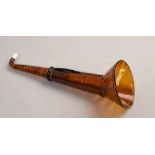 An early 20c simulated tortoiseshell ear trumpet, 12in l extended.