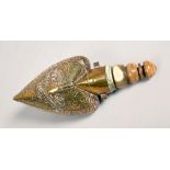 An early 19c Persian dowry flask of heart shaped form, the wooden body decorated with cut brass,