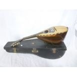 An old mandolin by F De Mureda of Napoli dated 1909 with inlaid rosewood case and mother of pearl