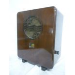 An Art Deco mahogany cased rectangular radio by Phillips with pierced fretwork circular panel