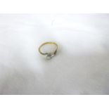 An 18ct gold engagement ring with platinum shoulders set two diamonds