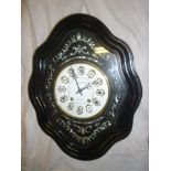 An 19th century French wall clock by Regent with enamelled circular dial and individual numerals in