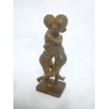An unusual old tribal carved wood figure of two wrestling male figures,