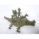 An African Benin-style tribal bronze figure of numerous characters and animals on a crocodile,