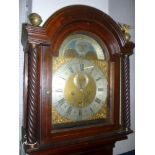 An 18th Century longcase clock by Buffett of Colchester with 12" brass and silvered arched dial