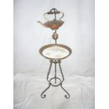 An unusual Late Victorian/Edwardian wrought iron and copper mounted occasional table with inset