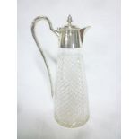 An Edward VII silver mounted cut glass tapered claret jug with hinged lid and loop handle,