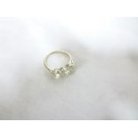 An impressive 18ct white gold engagement ring set three large diamonds