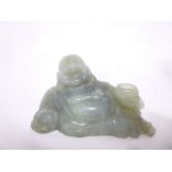 An Eastern jadeite figure of a reclining Buddha,