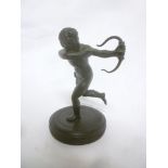A small old bronze figure of cupid on circular base,