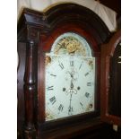A 19th Century longcase clock with 12" painted arched dial,