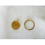 A 1980 gold quarter Krugerrand in gold pendant mount and one other 9ct gold blank pendant mount (2)