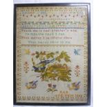 A Victorian rectangular needlework sampler depicting floral and bird design, alphabet and text,