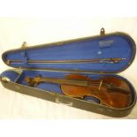 An old copy Stradivarius Saxony violin with 14" figured two-piece back in fitted case with bow