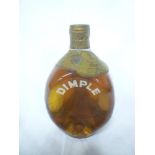 An old bottle of John Haig & Co Ltd Dimple whisky