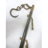 An unusual Chinese brass mounted staff with engraved polished wood shaft