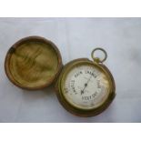 A gilt pocket barometer by Negretti & Zambra,