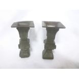 A pair of 19th Century Japanese bronze square tapered vases with raised decoration,