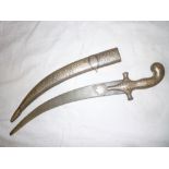 An Indo-Persian dagger with 13" curved decorated blade,