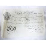 A Bank of England white £5 note dated 1955,