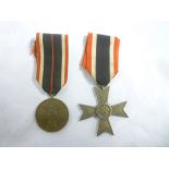 A Second War German War Merit cross without swords and a Second War Service medal (2)