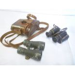 A pair of First War German military binoculars by Goerz and one other pair of First War German