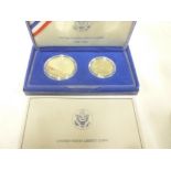 A United States Liberty silver proof dollar and half dollar coin set,