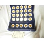 A collection of 25 gold plated USA State quarter dollars,