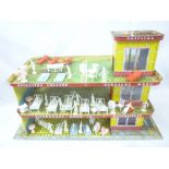 An unusual Mettoy tin plate hospital with various plastic figures and furniture