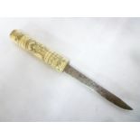 A Japanese Tanto dagger with single edged blade and carved bone hilt