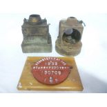 Two various railway lamp fitments and a 1932 iron railway wagon plate