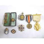 A selection of various medallions and badges including gilt Primrose League medal,