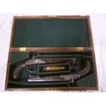 A pair of 19th Century cased percussion pistols by Bass of London with 9" octagonal barrels,