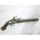 A late 18th Century French flintlock holster pistol with 11" steel barrel, engraved steel lock,