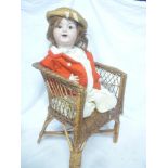 A child's porcelain headed doll by Simon and Halbig of Germany with painted face,