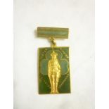 An enamelled gilt medallion for the Irish Womans Association - Kensington Palace