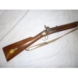 An old Colonial percussion two-band musket with polished stock and brass mounts