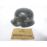 An unusual German Second War M34 Luftschutz steel helmet with Krupp factory marking,