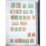 A stock book containing a collection of British Empire stamps,