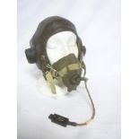 A Second War brown leather flying helmet together with oxygen mask