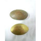 Two Cornish miner's brass oval snuff boxes,