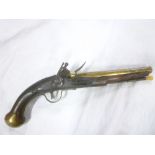 An 18th Century flintlock brass barrelled holster pistol by Thomas Rea of London with 9" brass