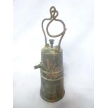 An unusual bronze Pinnacle open-flame miner's lamp with tapered body and swing handle