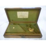 A 19th Century oak baize-lined revolver case bearing the original label for W Watson & Son of