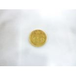 A Victorian 1864 gold Shield-back sovereign (nef)