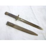 A Middle Eastern bayonet with single edged blade in steel scabbard