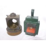 A small painted metal railway hand lamp with oil burner and one other part railway lamp insert (2)