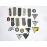 A selection of original German Second War cloth insignia including chevrons etc and a quantity of