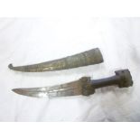 A 19th Century Eastern dagger with 9" curved double edged blade,