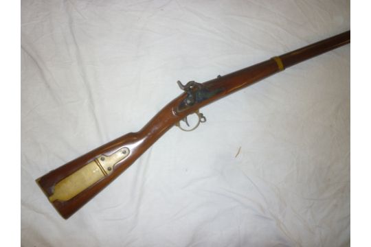 A replica .58 Western percussion musket with brass mounted patch box